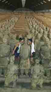 Customer posing for picture at terracotta warriors